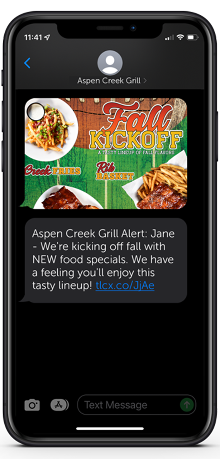close up of a phone displaying a text message for new food specials at Aspen Creek Grill